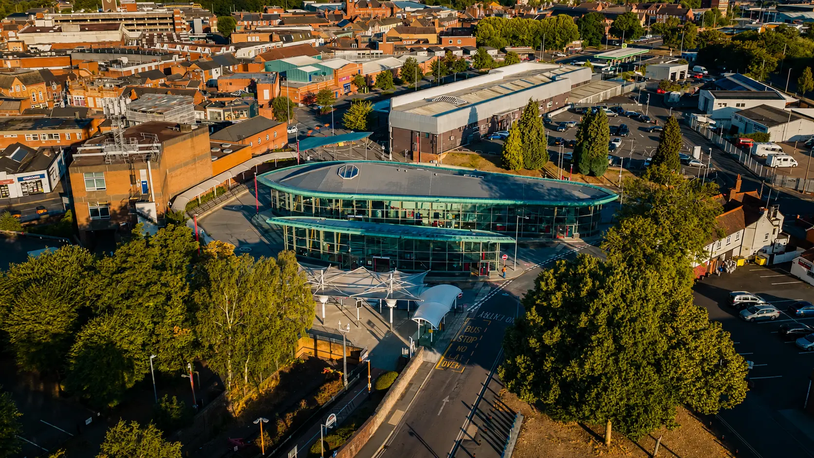 Golden-hour aerial of Stourbridge Interchange bus station and the streets around it