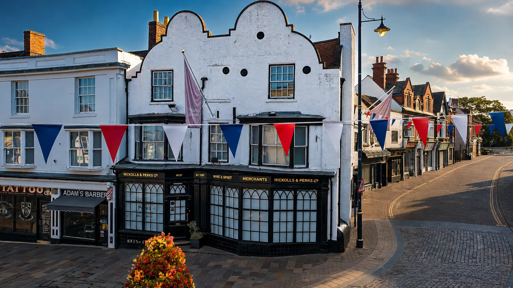 Nickolls & Perks wine merchants on Stourbridge high street with bunting overhead
